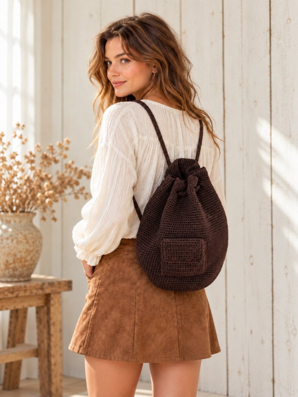 The Sak Brown Crochet Drawstring Backpack Rustic Boho Woven Bag Front Zip Pocket